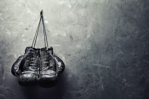 boxing gloves hanging on a wall